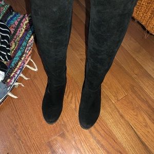 Black knee high boots.